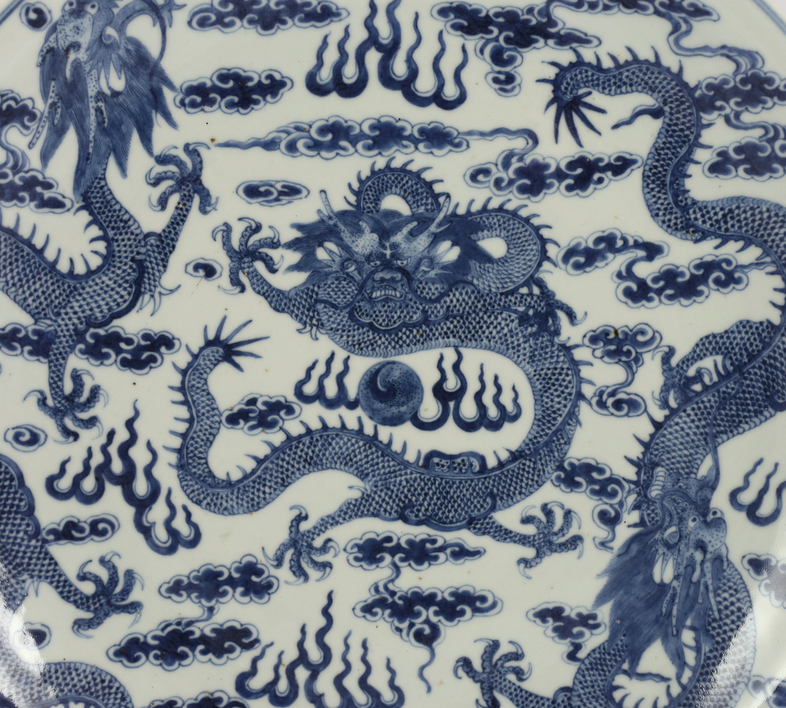 A Chinese blue and white ‘dragon’ dish, Kangxi mark, 19th century